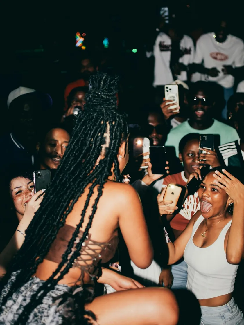 Fans cheering a performer at a concert in Lagos